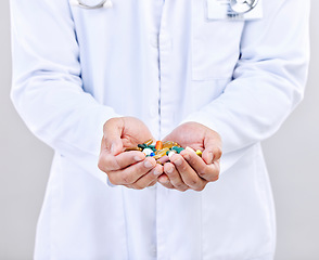 Image showing Pharmacist pills, palm or man hands with closeup in pharmaceuticals, drugs or medicine supplement for healthcare. Medical pharmacy, studio or doctor with prescription medication on white background