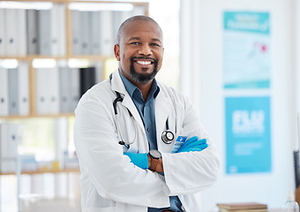 Image showing Portrait, doctor smile and black man with arms crossed, pride for career, occupation or job in clinic. Healthcare, mature person and happiness, proud and confident medical professional from Nigeria.