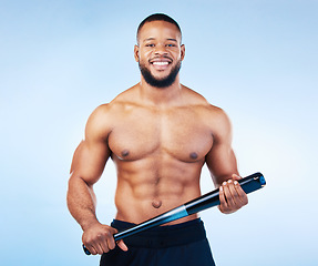 Image showing Black man, portrait and sports body with a baseball bat in studio for health, wellness and fitness. Face of healthy male aesthetic model with sport gear, strong muscle and smile on a blue background