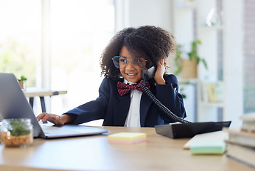 Image showing Young child, playing office and phone call with laptop for networking, contact or communication. Girl, smile and listening for deal, negotiation and reading website on computer at desk in workplace