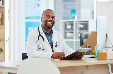 Image showing Healthcare, portrait and black man doctor in his office with a clipboard to analyze test results. Success, smile and professional African male medical worker working on a diagnosis in medicare clinic