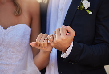 Image showing Wedding, rings and closeup of a couple with a pinky promise for love, loyalty and marriage. Romance, hands and married man and woman with jewellery for their union and bond at a romantic event.