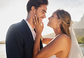 Image showing Wedding, happy couple and lake with a bride feeling love, care and support from marriage together. Nature, happiness and romantic embrace of young people with a smile from trust and commitment event