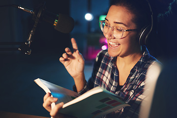 Image showing Radio dj, presenter and woman in a sound production studio reading a book with happiness. Headphones, recording and working female employee with discussion on air for web podcast and books talk