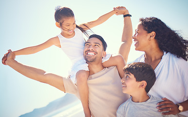 Image showing Happy family, love and beach piggyback with kids and parents bonding on blue sky background. Travel, smile and children with mom and dad on ocean vacation, holiday or trip, excited and joy in Miami