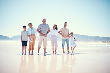 Image showing Portrait of big family on beach walking together, grandparents and parents with kids smile together on vacation. Sun, fun and ocean happiness for hispanic men, women and children on summer holiday.