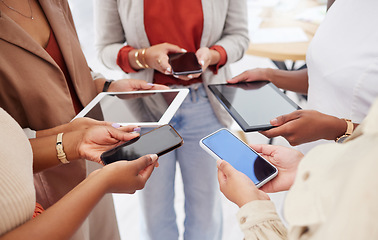 Image showing Collaboration, technology and networking with a team of business people in a huddle to share information. Group, data and communication with colleagues standing in a circle in the office at work