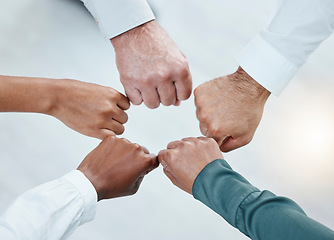 Image showing Teamwork, fist bump and hands of business people together for motivation, support and community. Collaboration, team building and top view of employees in circle for diversity, solidarity and goals