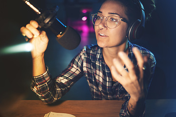 Image showing Podcast, microphone and live streaming woman speaking, advice or broadcast on gen z platform at night. Serious influencer person with voice talking on mic for news, politics or media report on radio