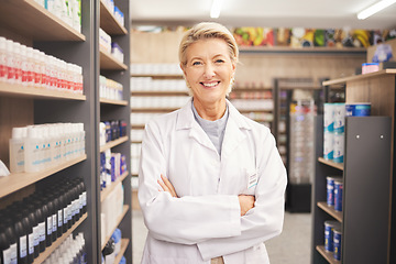 Image showing Pharmacy, senior woman pharmacist in portrait at drug store and pills with medicine for healthcare. Drugs, health and arms crossed, pharmaceutical and happy with confident female medical professional