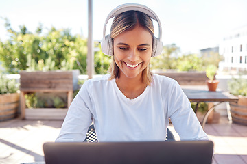 Image showing Woman, laptop and headphones, student and education with smile, study and online course, elearning and university. Female at outdoor cafe, writing thesis and listen to music with research for paper