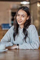 Image showing Cafe, relax and portrait of woman with coffee in restaurant with hot beverage, cappuccino and latte drink. Happy, smile and face of real girl sitting by table for relaxation and happiness on weekend