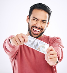 Image showing Money, cash and portrait of man wink on white background for investment, financial savings and payment. Finance profit, winner and excited male for winning, bonus and stock market success in studio