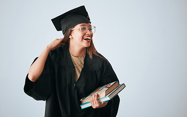 Image showing Graduation cap, books and happy woman isolated on studio background education, college or scholarship success mockup. Biracial university student or graduate with reading knowledge and learning goals