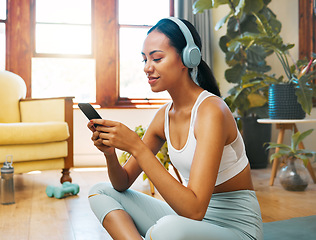 Image showing Headphones, phone and yoga woman listening to meditation music, podcast or wellness audio for mental health. Fitness, exercise and pilates person typing on cellphone for music streaming on mobile app