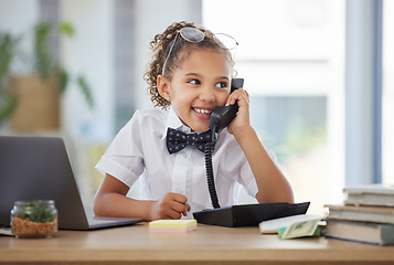 Image showing Children, telephone and a girl playing in an office as a fantasy businesswoman at work on a laptop. Kids, phone call and a female child working at a desk while using her imagination to pretend