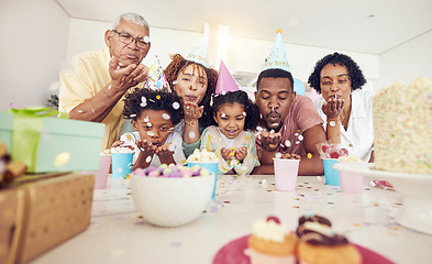 Image showing Birthday, party and confetti with family in kitchen for celebration, bonding and affectionate. Happiness, excited and grandparents with parents and child at home for surprise, fun and event