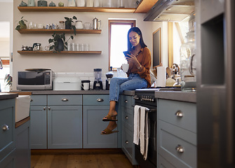 Image showing Relax, kitchen and woman with phone, coffee and smile while browsing internet, checking social media or reading email. Chat, connect and working from home lifestyle, freelancer on break in apartment.