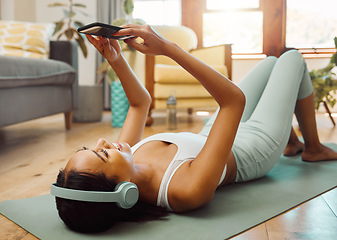 Image showing Relax, phone or happy woman on social media for yoga content for wellness, fitness or healthy lifestyle. Mobile app, meme or girl smiling online after exercise, workout or training in house studio