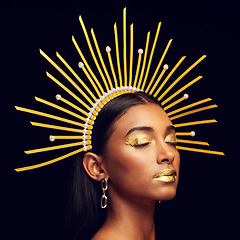 Image showing Crown, gold makeup and an elegant queen isolated on a black background in a studio. Dreaming. art and an Indian goddess with cosmetics, accessories and jewelry for royalty on a dark backdrop