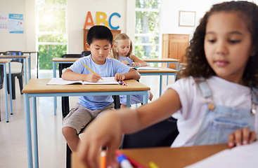 Image showing Education, drawing or Asian boy in classroom learning, exam or studying with preschool notebooks. Development or serious kids or young students with creative art writing for knowledge in kindergarten