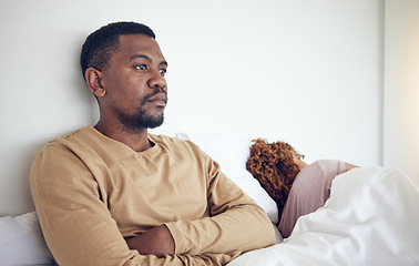 Image showing Couple fight, angry black man and bedroom with a woman together feeling frustrated in a bed. Home, conflict and relationship problem of a marriage fail, divorce issue and break up stress in morning