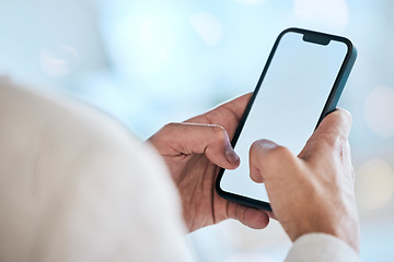 Image showing Businessman, hands and phone with mockup screen for social media, advertising or marketing at office. Hand of man typing on mobile smartphone app display for communication or networking on copy space