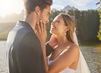 Image showing Wedding, couple and lake water with a bride feeling love, care and support from marriage together. Nature, happiness and romance event of young people with a happy smile from trust and commitment