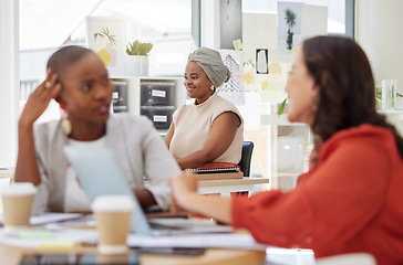 Image showing Smile, ambition and an african american business woman sitting at work in an office. Confident, focus and a professional behind a team of colleagues, determined to be a success in the company