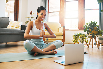 Image showing Yoga, meditation and namaste of woman on laptop online class, video call or webinar in holistic fitness or wellness. Biracial person meditate, praying hands and pilates exercise at home on computer