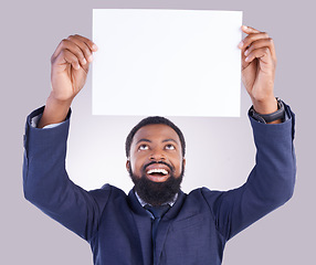 Image showing Business, excited man and poster in white background, studio or mockup space. Happy corporate, black male and holding board, marketing wow news and advertising banner for blank mock up, paper or sign