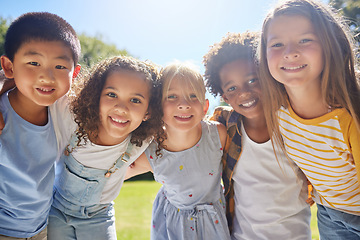 Image showing Happy, smile and portrait of kids in a park playing together outdoor in nature with friendship. Happiness, diversity and children friends standing, embracing and bonding in a outside green garden.