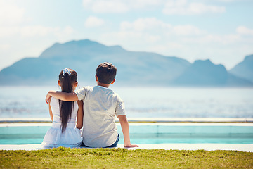 Image showing Siblings, hug and back by ocean with love in mock up space for kids, family holiday and outdoor. Children, girl and boy with support by mountain, sea and waves with mockup on summer vacation on lawn