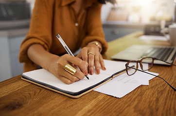 Image showing Closeup, writing and woman on laptop with documents for budget, savings and paying bills in her home. Paper, financial and future planning, investment and growth by female checking finance notes