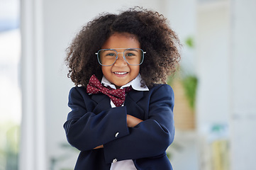 Image showing Portrait, business person and black child arms crossed, confident and happiness in office. Face, African American female child and kid with gesture for leadership, employment and smile in workplace