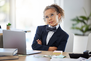 Image showing Bored, kid and thinking with pretend office work and laptop with ideas. Job, child and little girl playing dress up as working executive at desk with paperwork and eyes rolling feeling annoyed