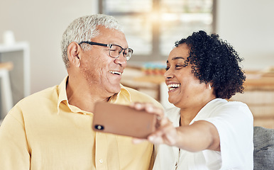 Image showing Senior couple, smile and selfie in house with love, bonding and hug for support, relax and laugh on blog app. Elderly man, old woman and social media for comic profile picture in home living room