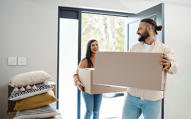 Image showing Couple moving, new house and box with happiness, man and woman, real estate property and home owner. People carrying boxes, laughing together and partnership, happy with mortgage and funny relocation