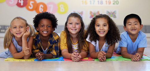 Image showing Education, portrait or happy kids in classroom learning or studying in preschool together with support. Children development, diversity or students with growth mindset for knowledge in kindergarten