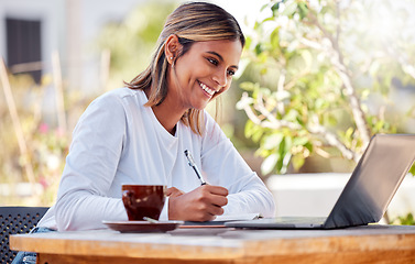 Image showing Woman writing notes, student and laptop, learning with smile and study academic course, education and university. Female at outdoor cafe, freelancer and research for project, happy with productivity