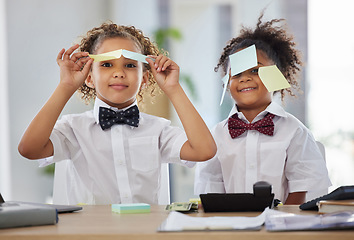 Image showing Kids, together and playing office with sticky note in portrait with happiness, brainstorming and teamwork. Siblings, girl and happy with paper, planning or play as business people for bond with games