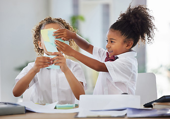 Image showing Children, sticky note and face for play at office desk with happiness, brainstorming or teamwork at company. Kids, group girl and paper for planning, comic or playing as business people for bonding