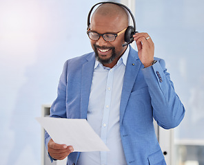 Image showing Black man, call center and business consulting with script for telemarketing, sales or customer service at office. Happy African American male salesman with headphones and policy for communication