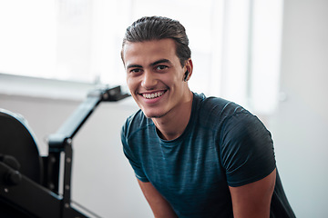 Image showing Man, fitness and smile in gym, earpods and listen to music for motivation to exercise with training and portrait. Health, active lifestyle and young male with radio streaming, wifi and workout