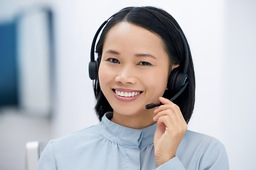 Image showing Asian woman, call center and happy in portrait, communication and CRM, headset with mic in office. Contact us, customer service or telemarketing, female consultant with smile and help desk