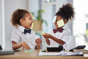 Image showing Happy, playful and girls pretending to be business people, having fun with sticky notes and office equipment. Smile, funny and children playing dress up, play pretend and a game of work together