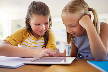 Image showing Tablet, kindergarten and girls in classroom for elearning, education and online knowledge. Friends, technology and happiness of kids or students with touchscreen in preschool for studying together.