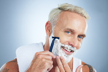 Image showing Senior man, razor and shaving for skincare grooming, beard or hair removal against a studio background. Portrait of happy mature male face with shaver, cream or foam for facial treatment on mockup