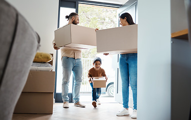 Image showing Family moving, new house and box with property, happy people and child with real estate and home owner. Excited kid, mortgage and relocation parents walking in front door with apartment move boxes