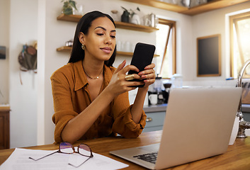 Image showing Remote work, phone and texting by business woman in kitchen with laptop, documents and form. Freelance, smartphone and female checking app, website or social media while working on online proposal